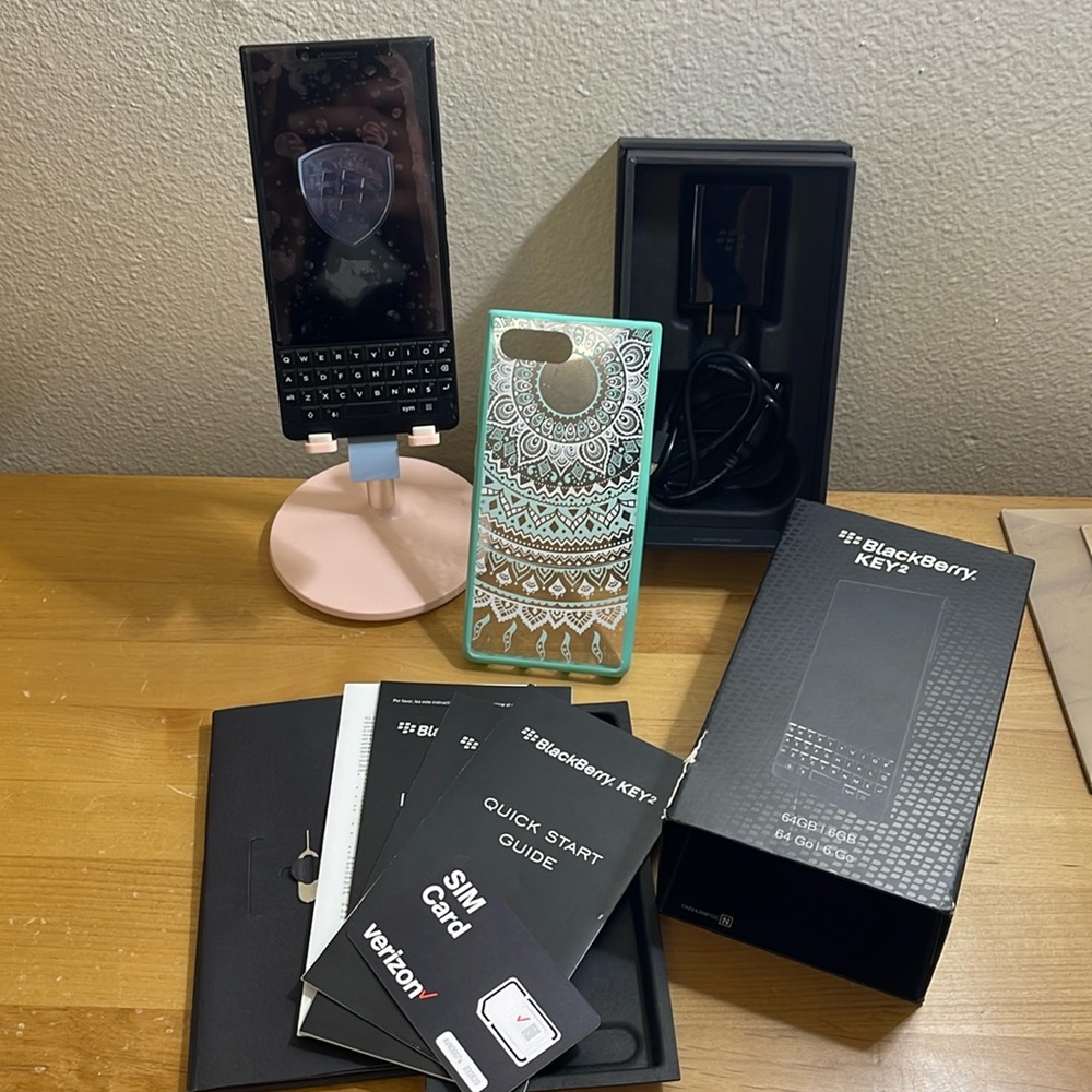 Blackberry Key 2-unlocked, paid about $700, never used. Comes w/everything
